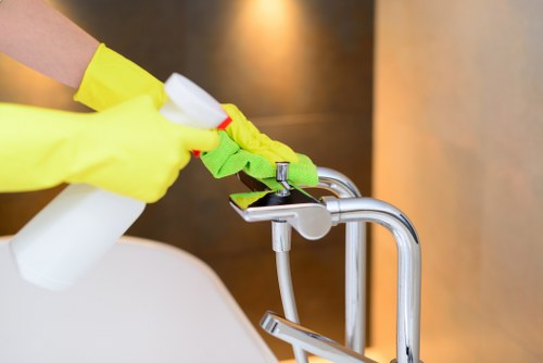 Local cleaning team working in an NW11 office kitchen and reception area
