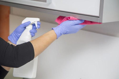 Detailed post-construction cleaning of kitchen surfaces in NW11